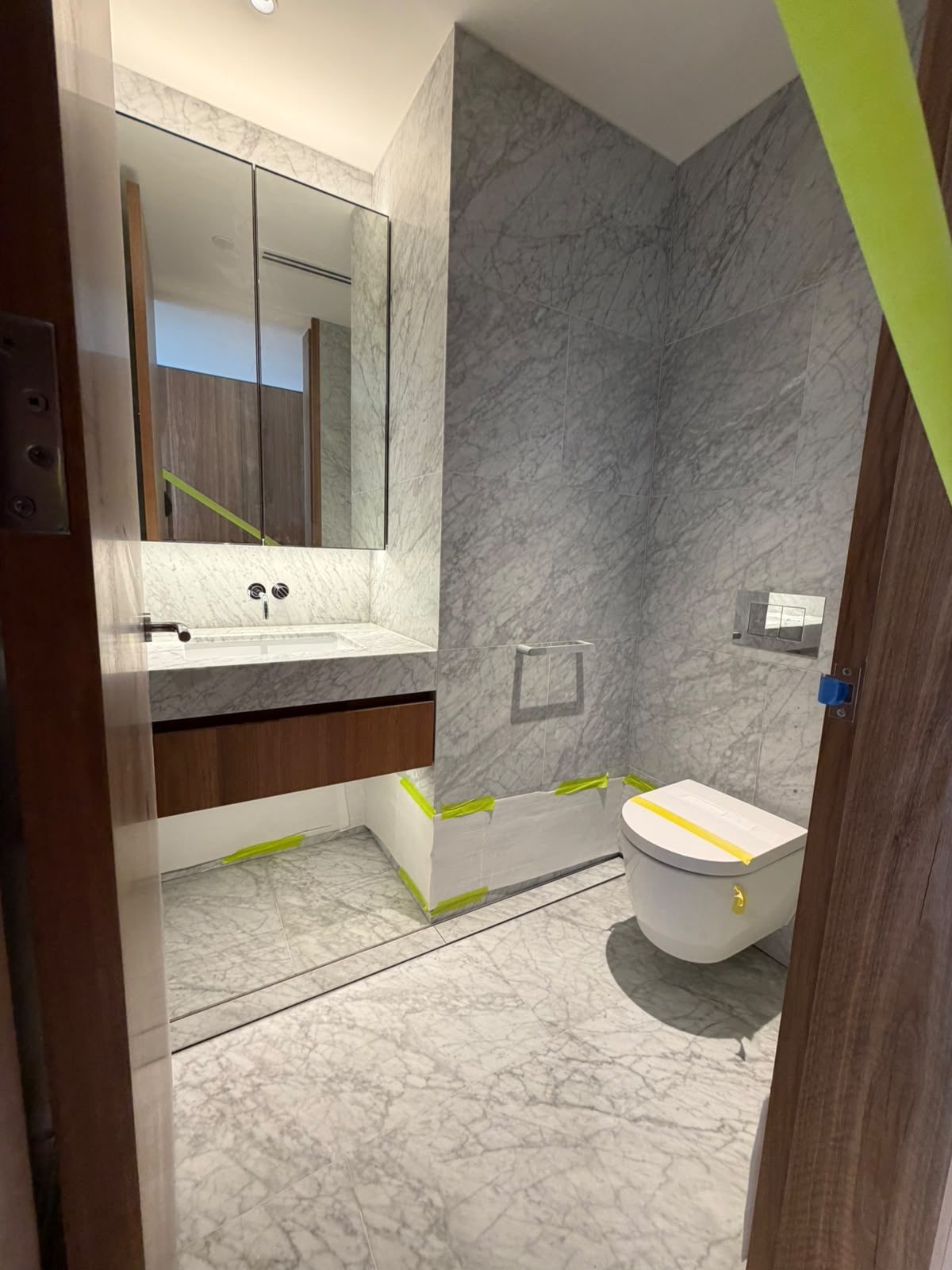 Bathroom renovation by Alta-Reno Services — vanity and marble finish