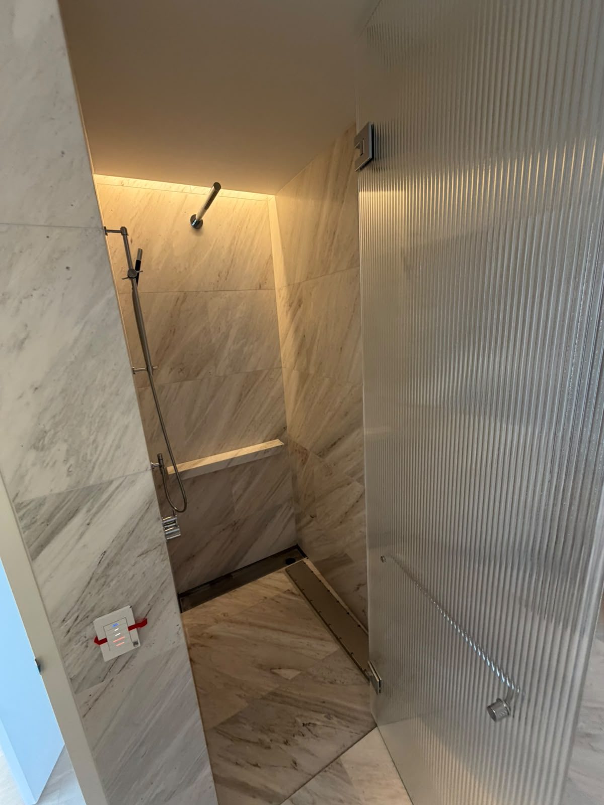 Bathroom renovation by Alta-Reno Services — frameless glass shower screen