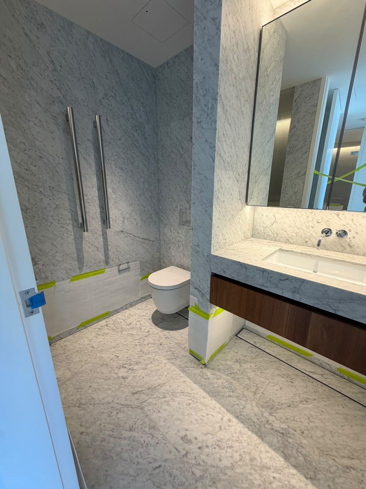 Bathroom renovation by Alta-Reno Services — vanity and mirrored cabinetry