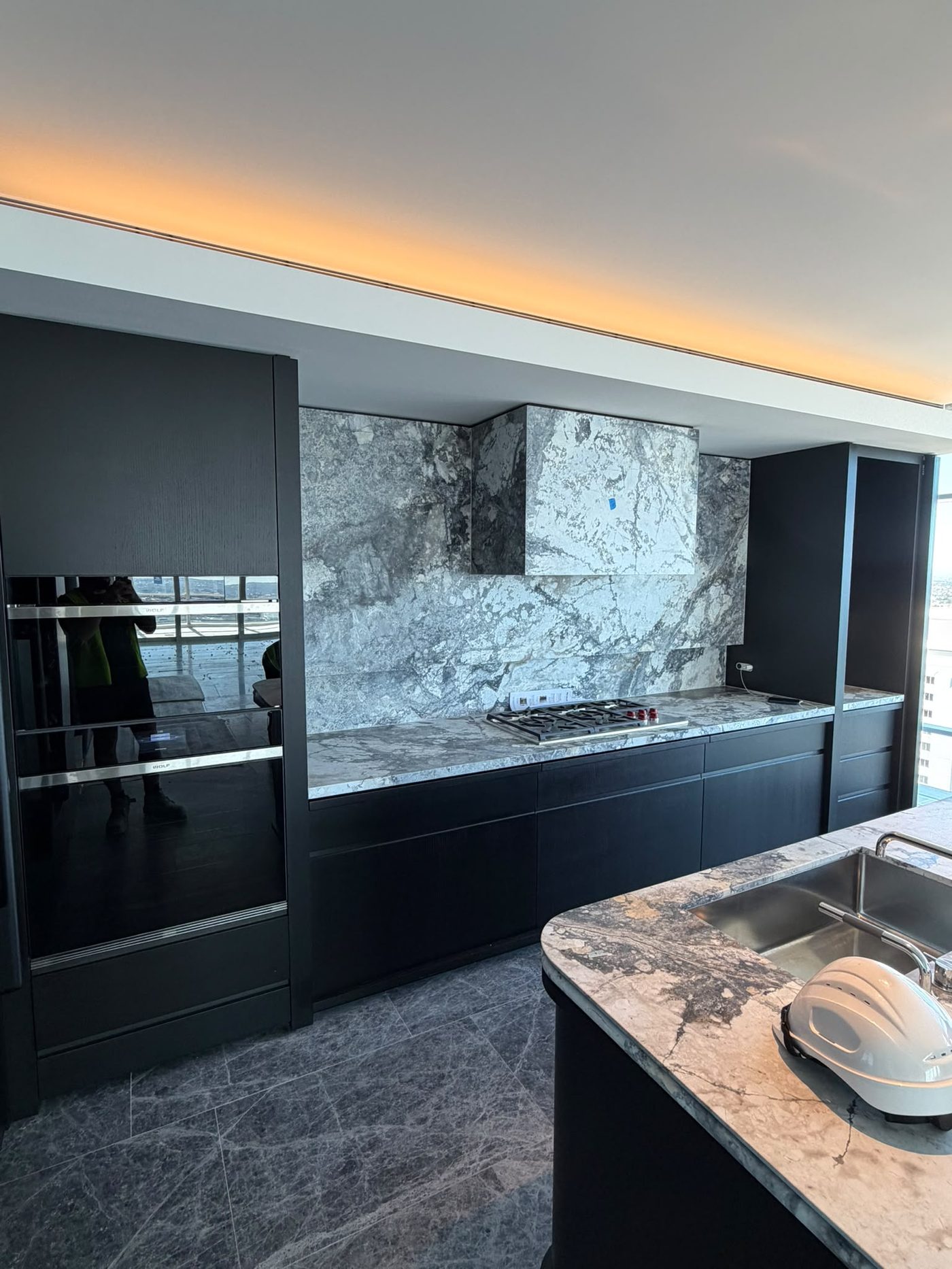 Kitchen renovation by Alta-Reno Services — cooktop and island bench